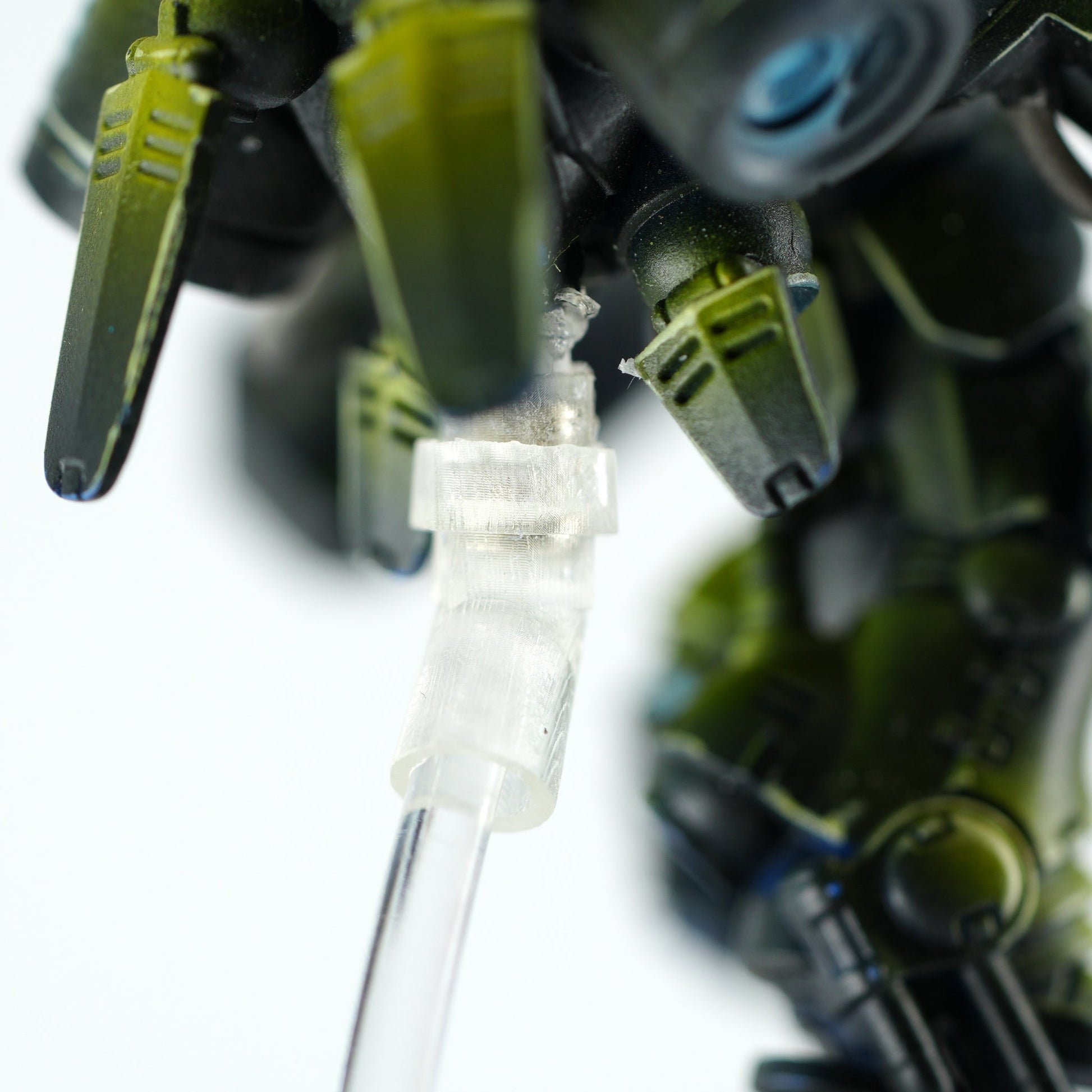 Side view of male and female hex plug caps joining a Primaris Inceptor to its swoop peg stand