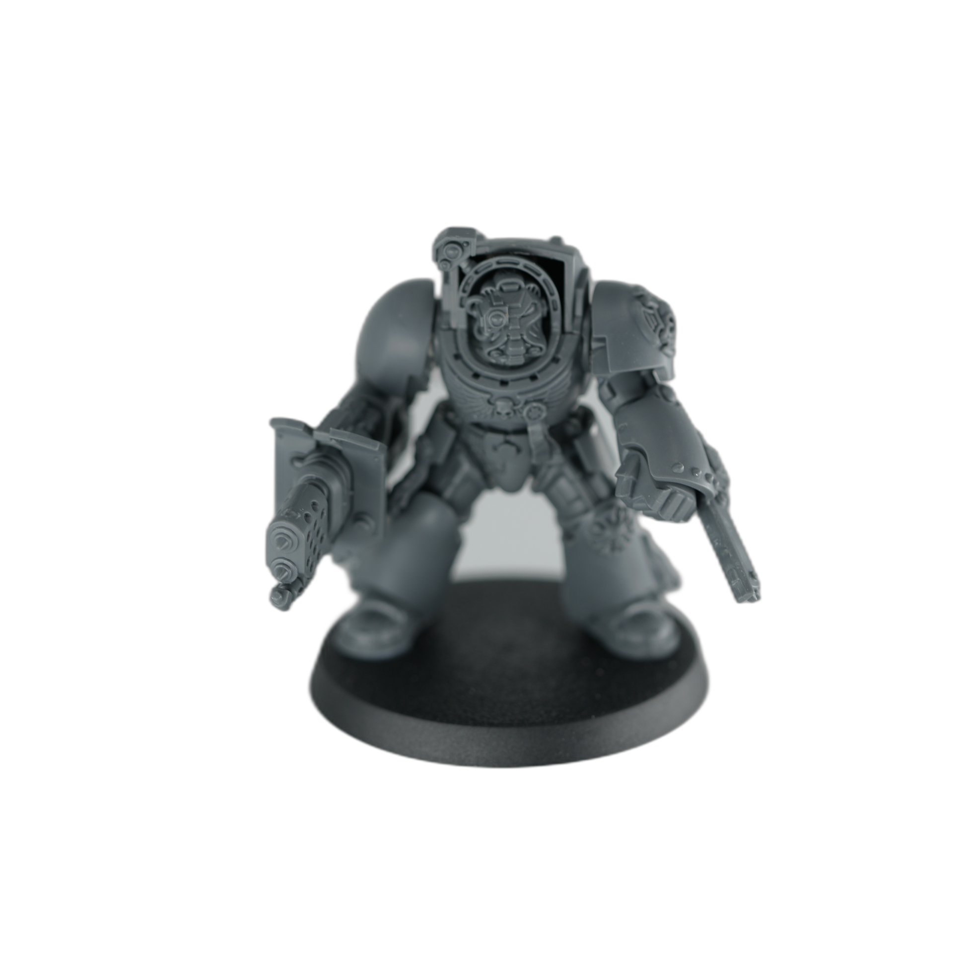 Unpainted Terminator built with a heavy weapon, an alternate magnetized loadout, on a 40mm base